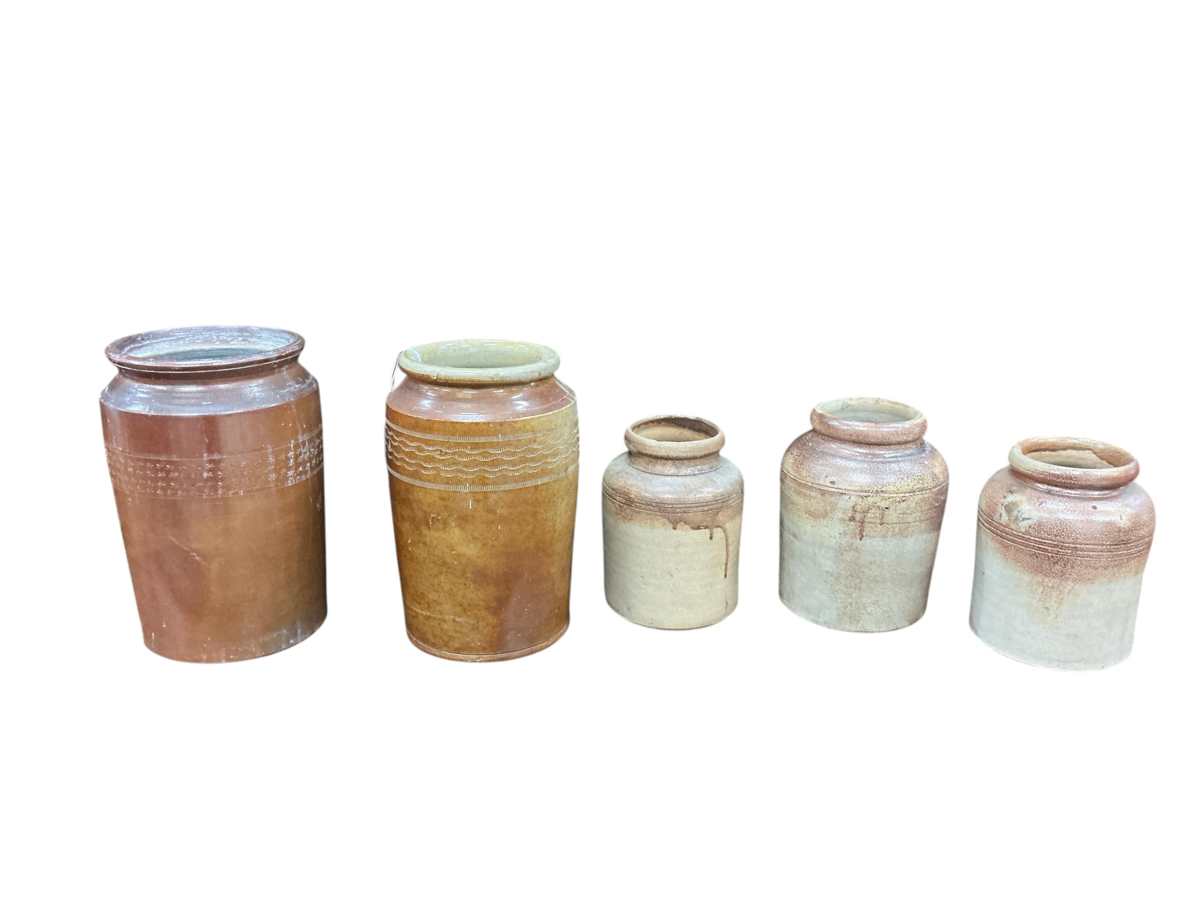 Five 19th century and later earthenware jars, largest height 32cm